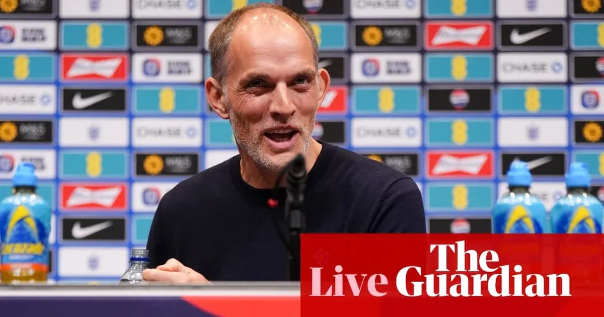 Manager speaking at press conference with backdrop