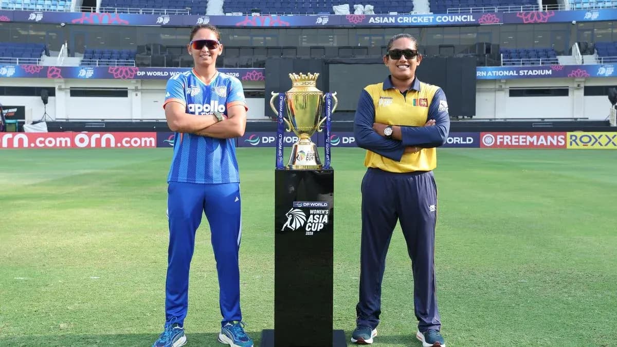 Two cricket team captains posing with trophy
