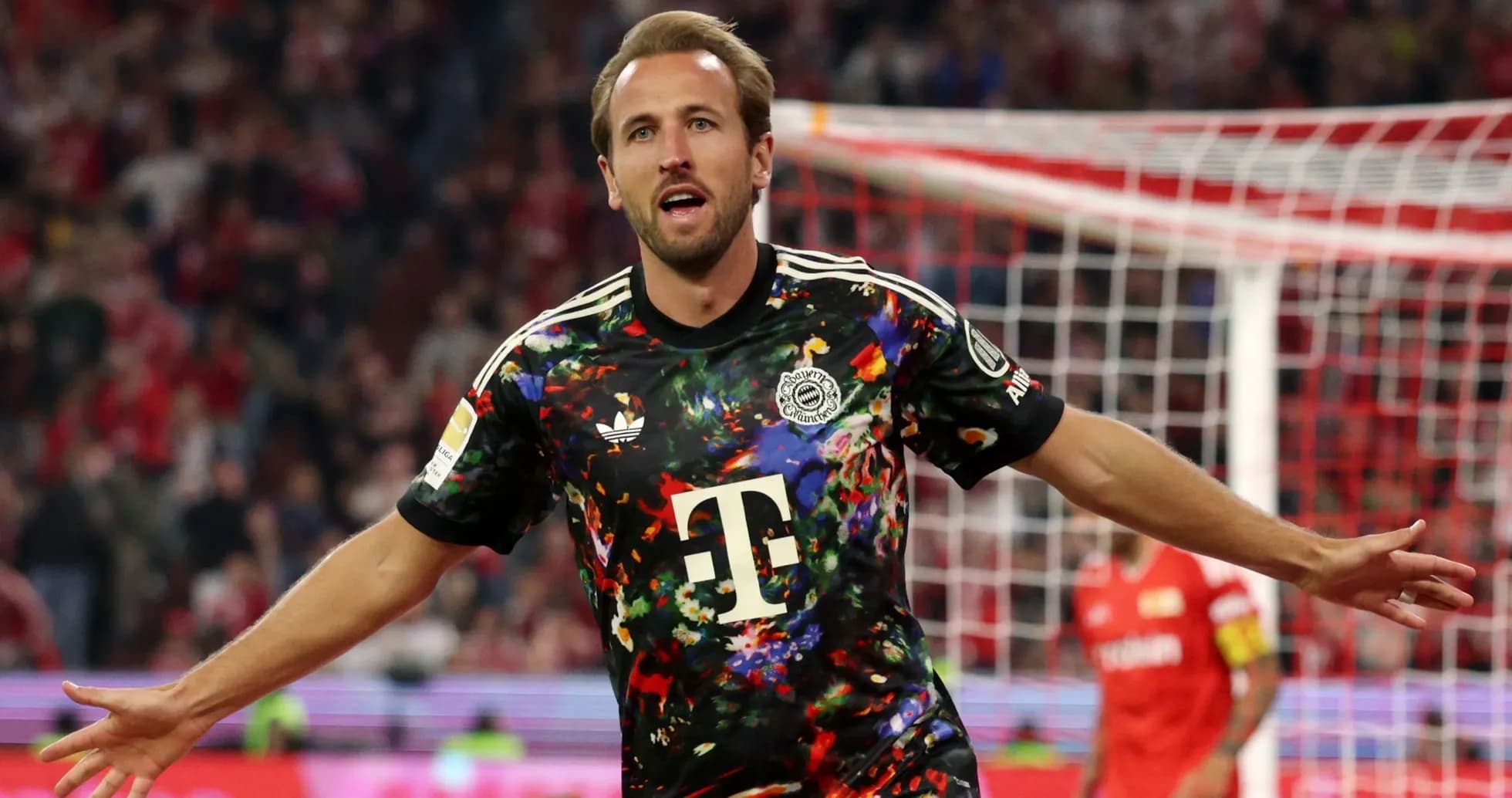 Player celebrating goal in colorful jersey during match
