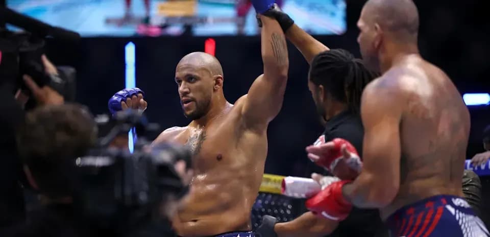 Fighter celebrating victory in the octagon after match