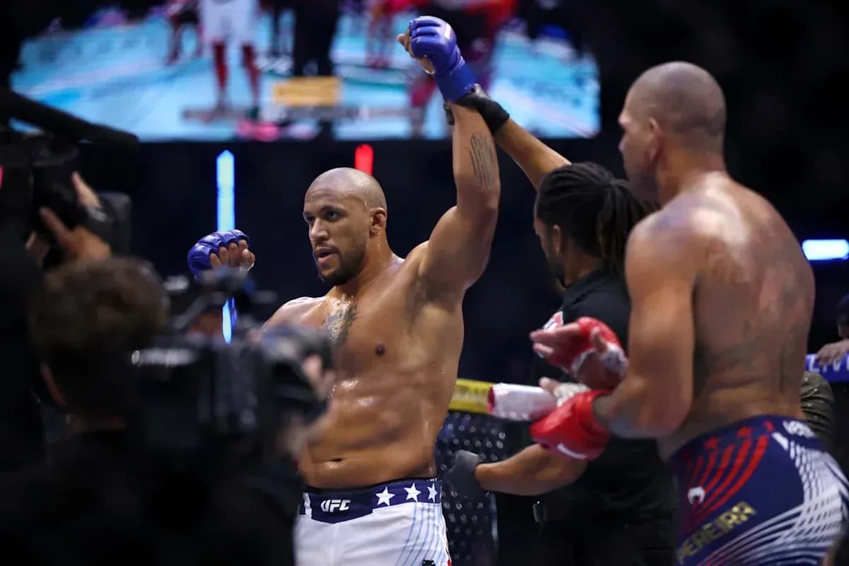 Fighter celebrating victory in the octagon after match