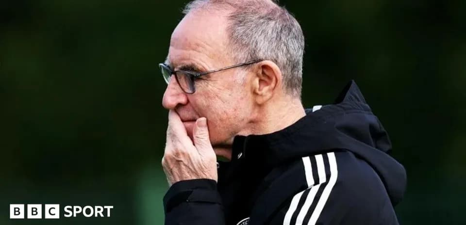 Manager observing during training session outdoors