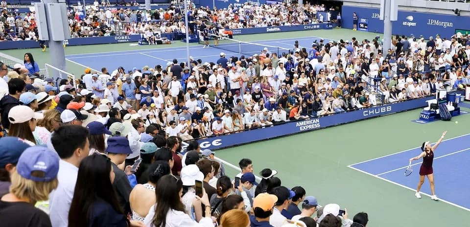 Crowd watching tennis match at US Open stadium
