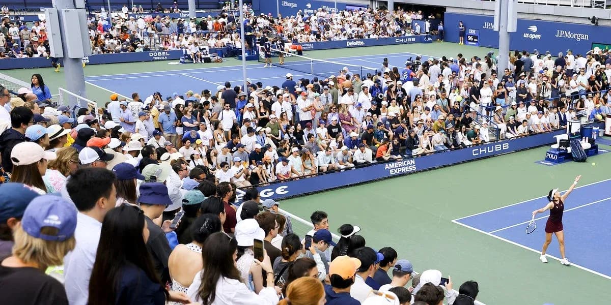 Crowd watching tennis match at US Open stadium