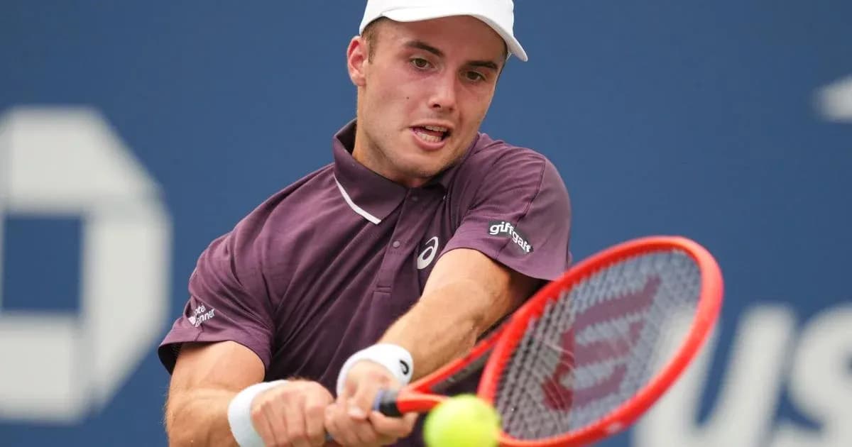 Tennis player hitting a forehand shot on court