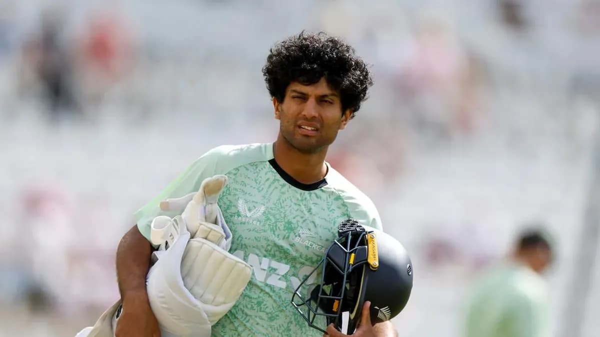 Cricketer carrying gear during practice session