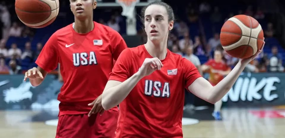 Two players in USA jerseys practicing basketball
