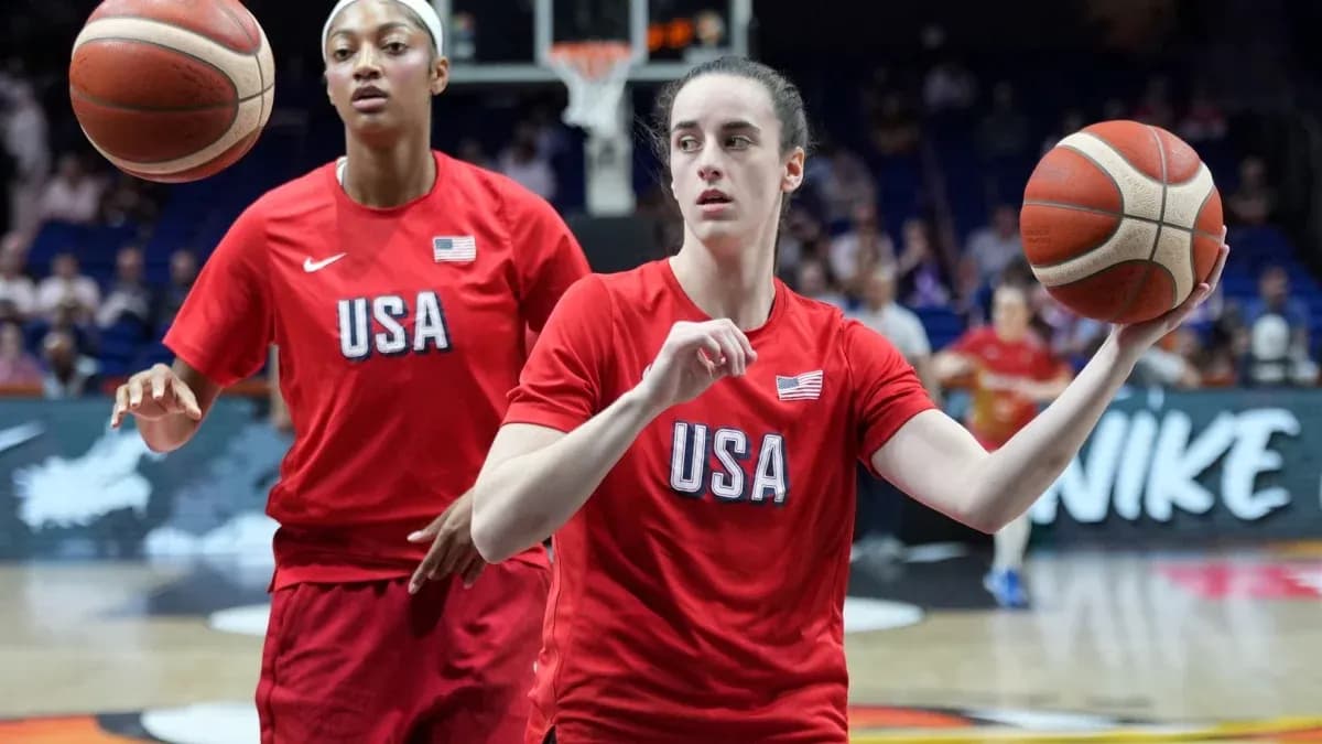 Two players in USA jerseys practicing basketball