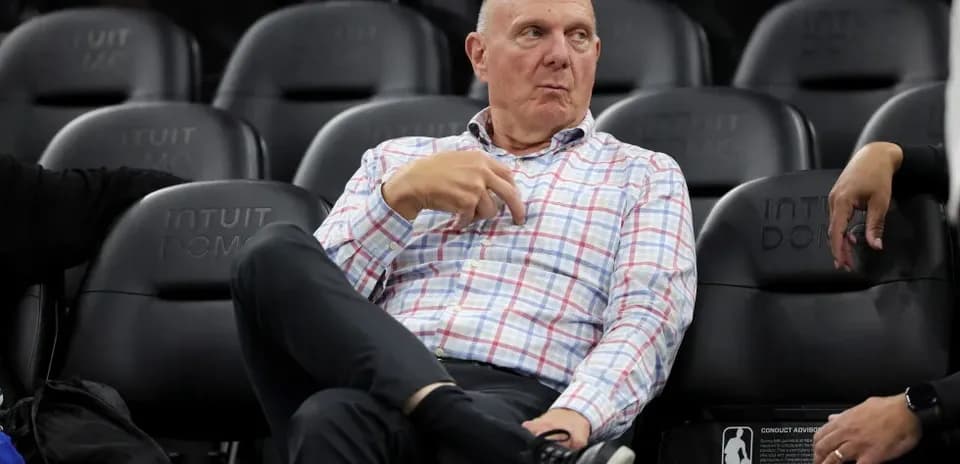Man seated courtside at Intuit Dome