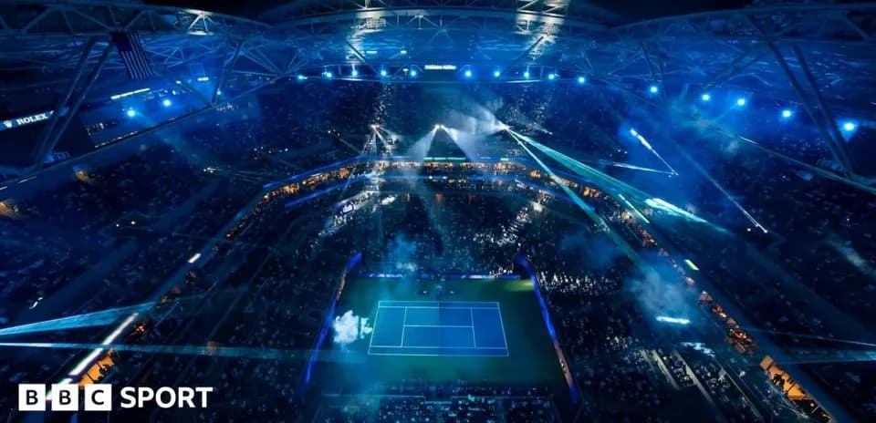 Aerial view of illuminated tennis stadium during event