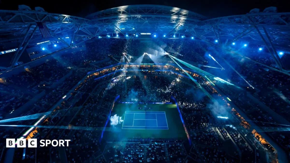 Aerial view of illuminated tennis stadium during event