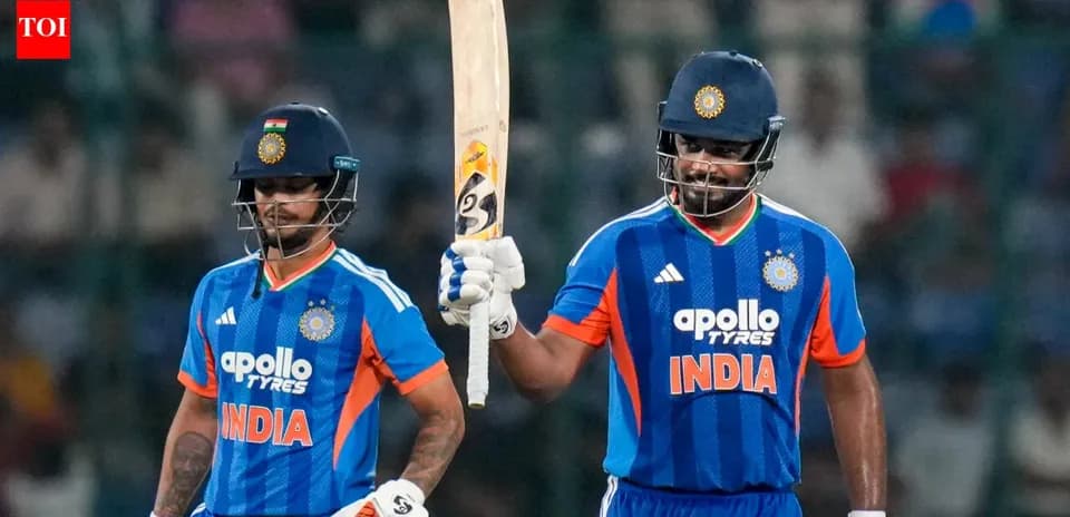 Two Indian cricketers celebrating on the field