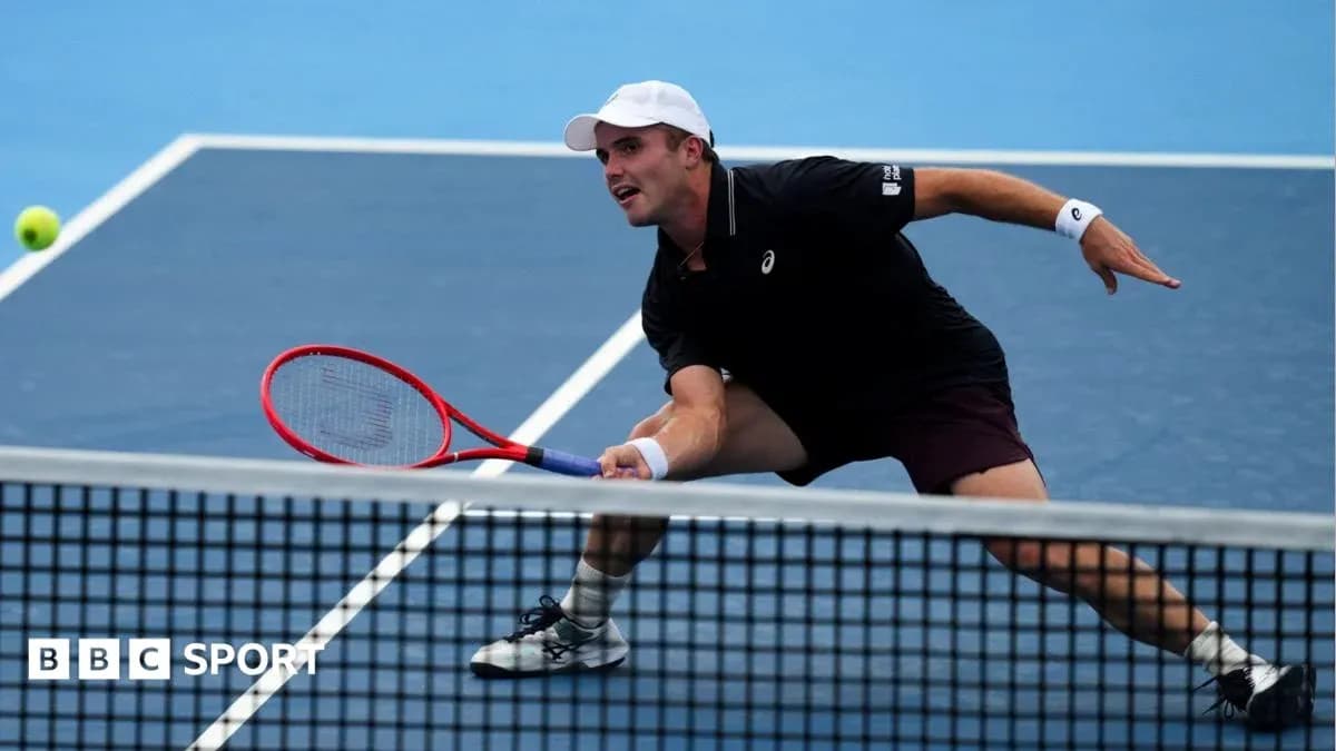 Player stretching to hit a tennis ball during match