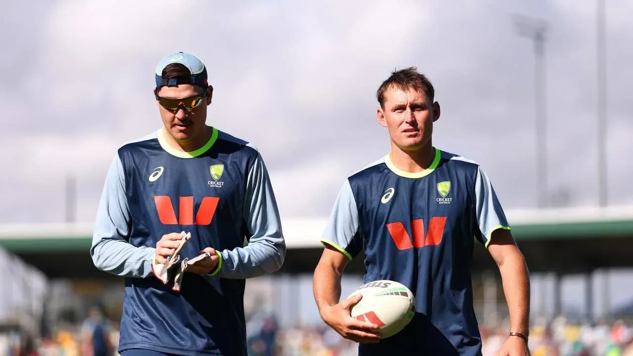 Two Australian cricketers walking during training session