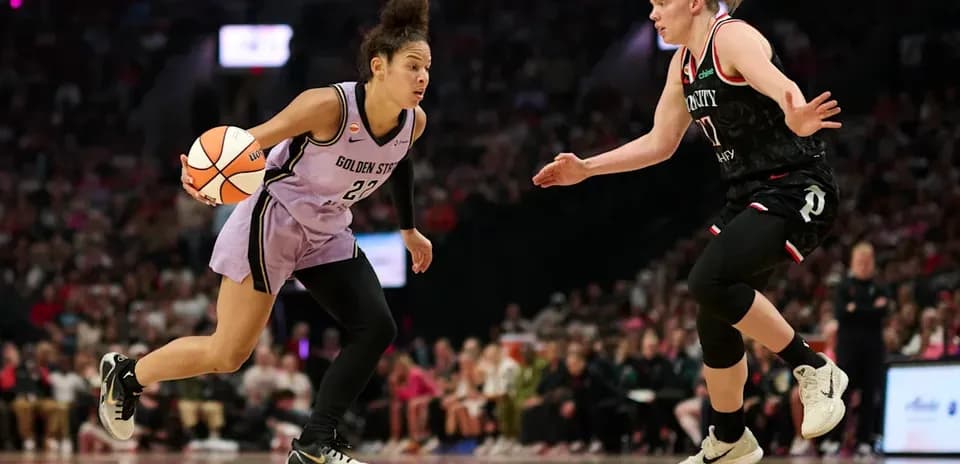 Player dribbling ball while being defended during game