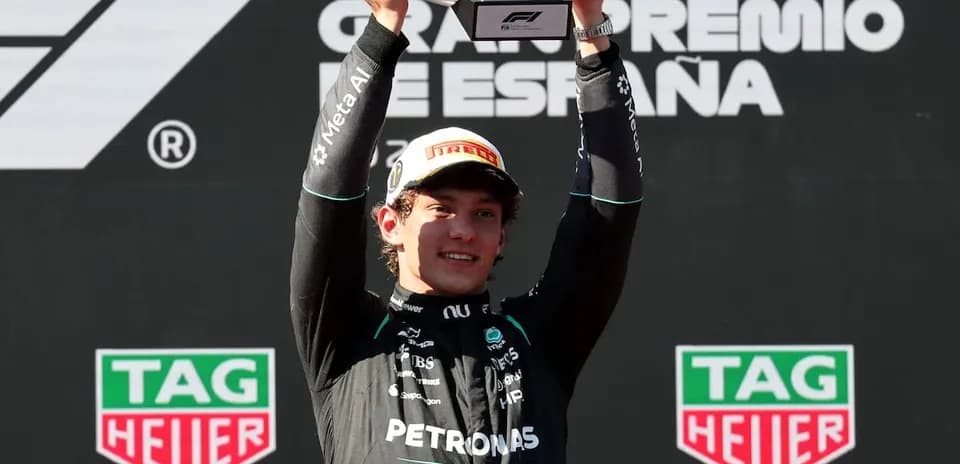 Driver celebrating with trophy at Spanish Grand Prix