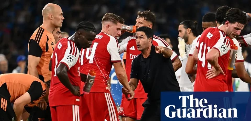 Arsenal players receiving instructions from manager during match