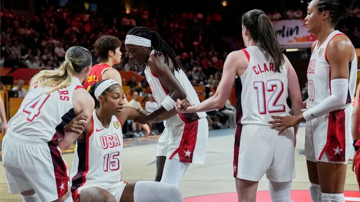 USA women's basketball team huddling during game