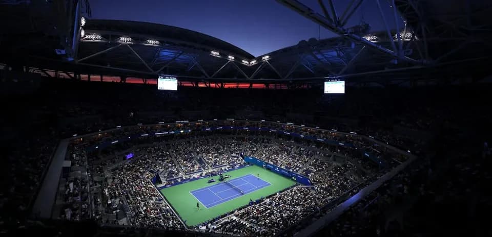 Night match at a packed tennis stadium