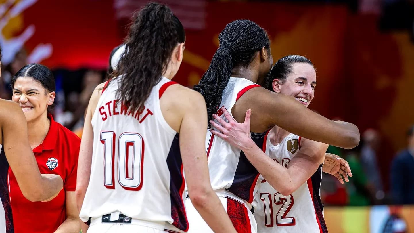 Players celebrating after a game, embracing each other