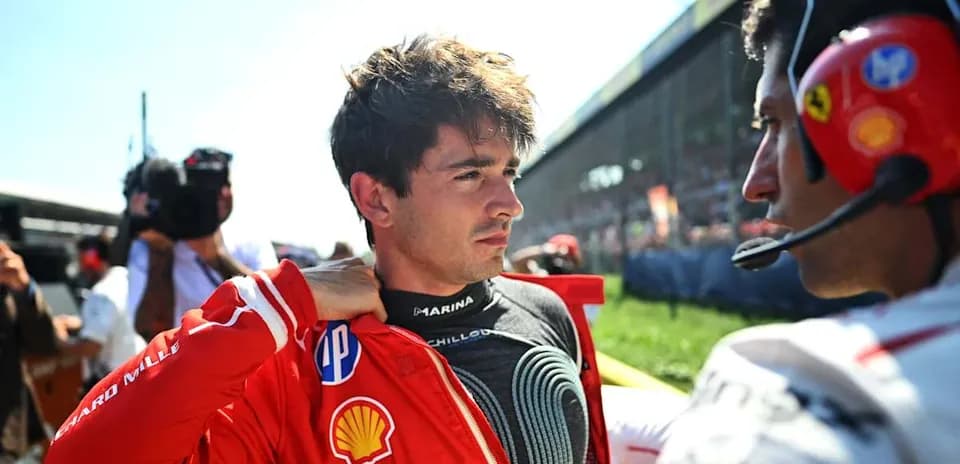 Driver preparing for race with team member beside