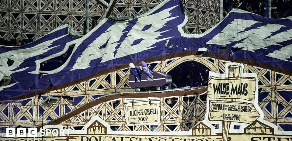 Large stadium display featuring roller coaster theme