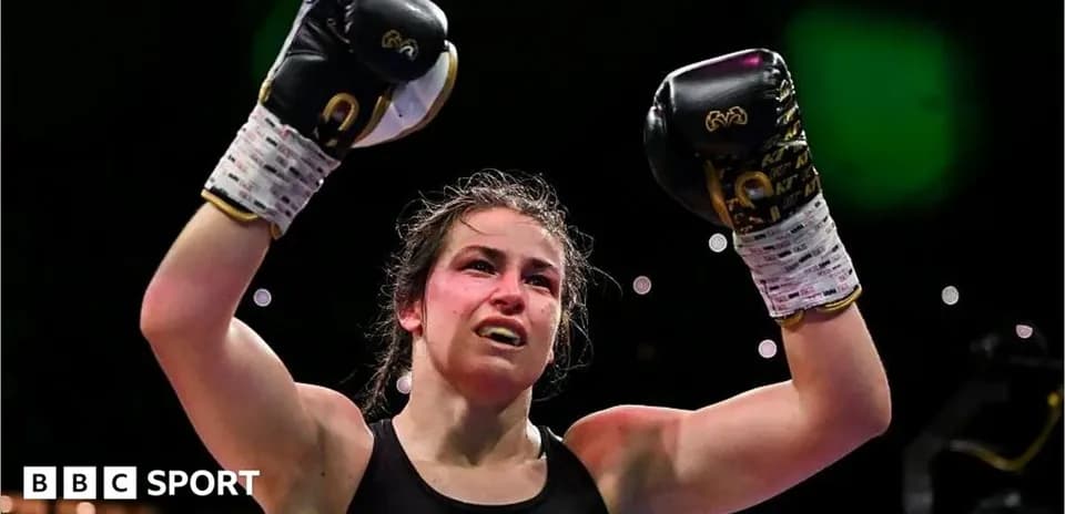 Boxer celebrating victory with raised gloves