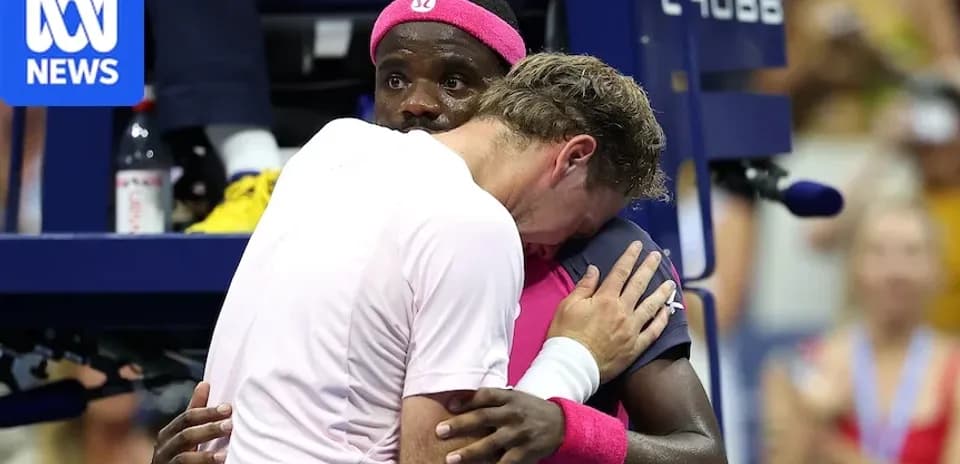 Players embracing during a tense moment at match