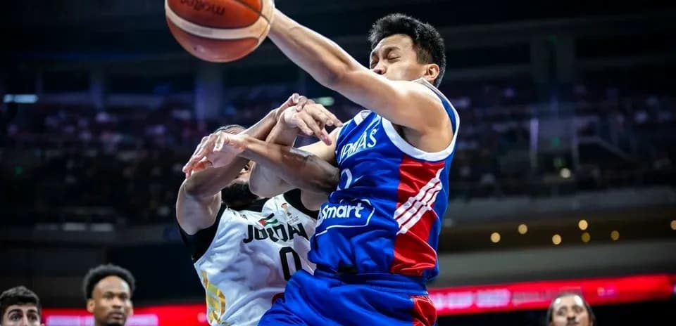 Player shooting the basketball while being defended