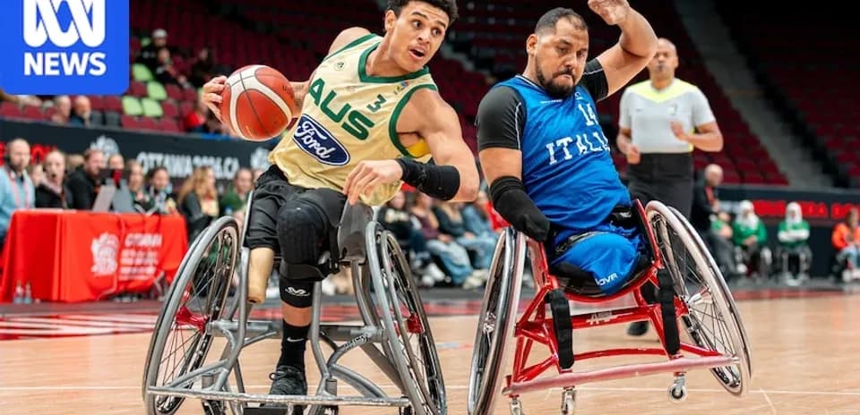 Two wheelchair basketball players competing for the ball