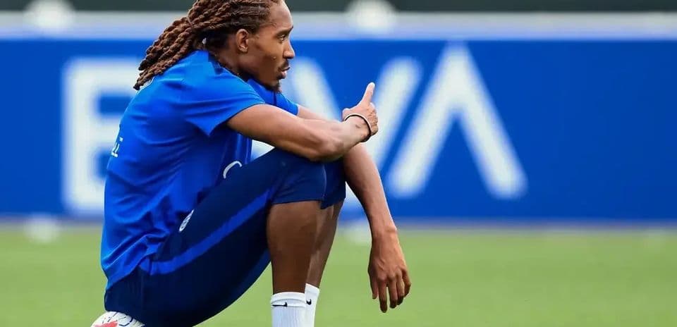 Player sitting on ball during training session
