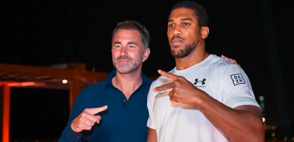 Two men posing for photo at event