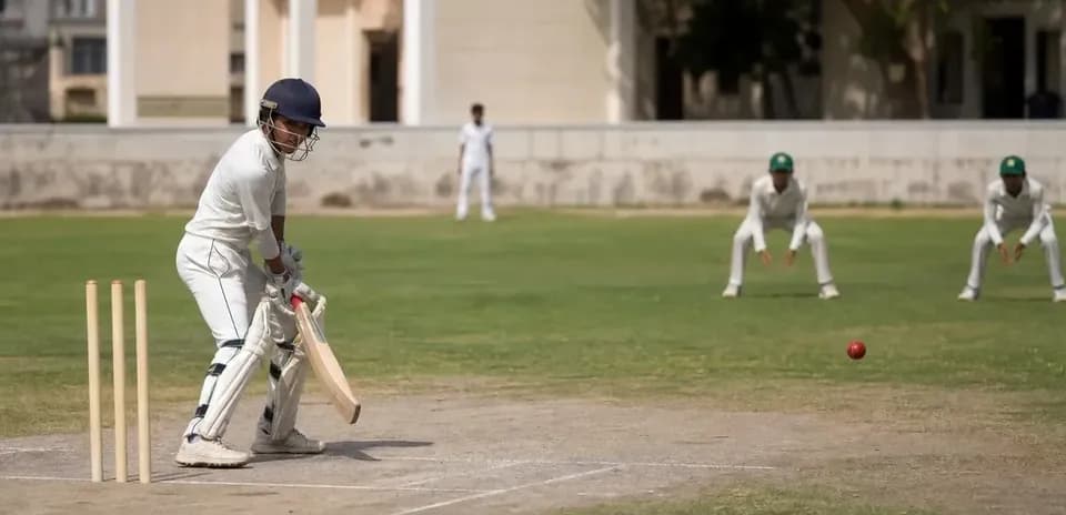 Batsman preparing to hit ball during cricket match