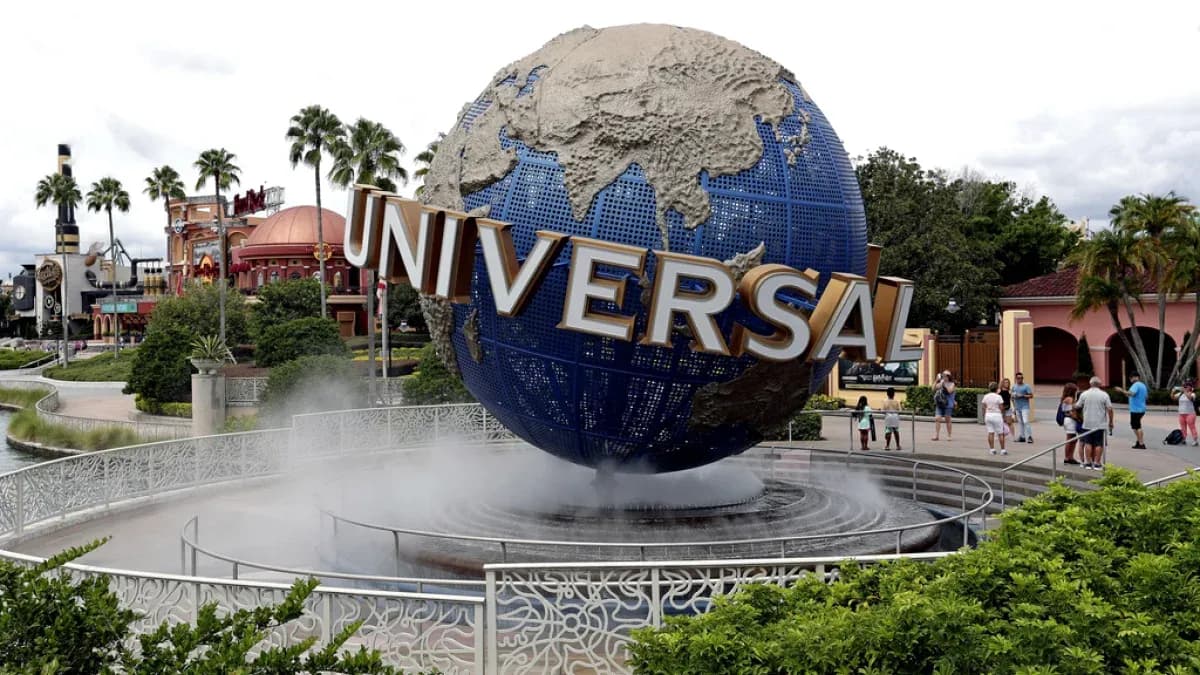 Universal Studios globe monument with visitors nearby