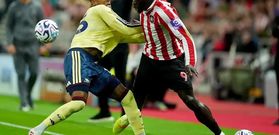 Two players competing for possession during a match