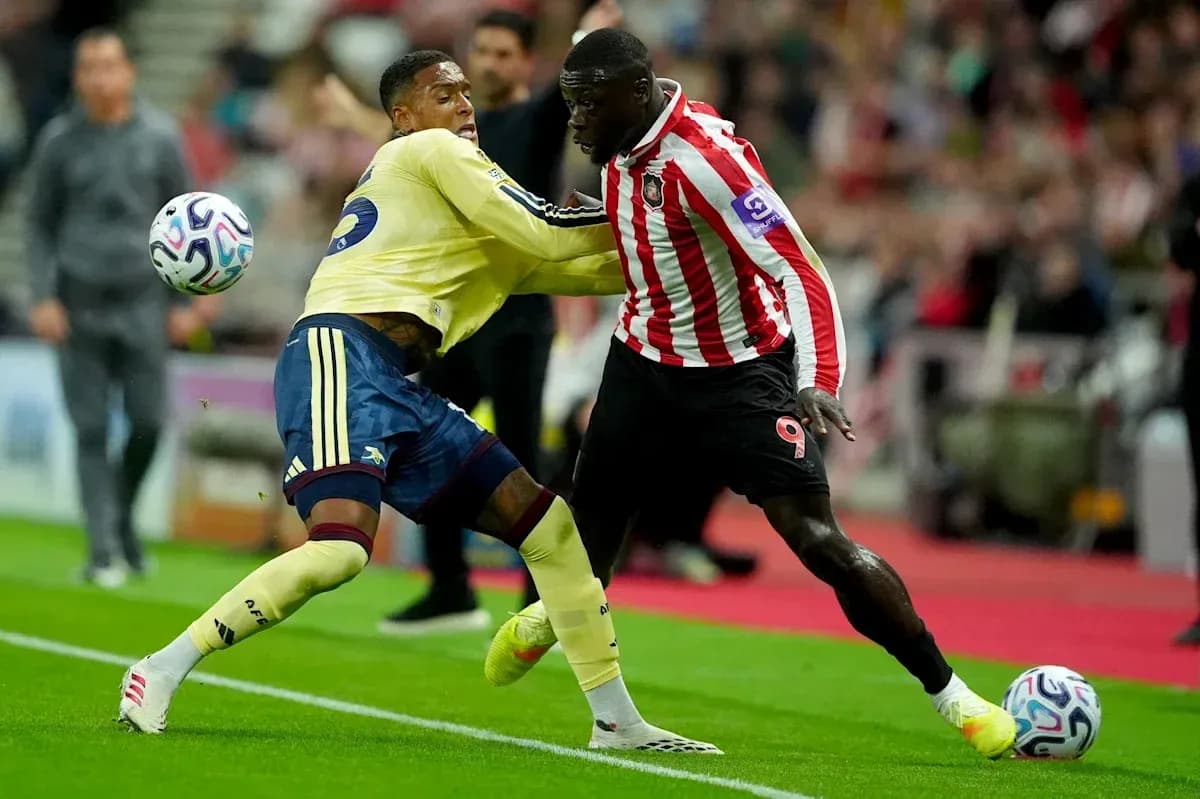 Two players competing for possession during a match