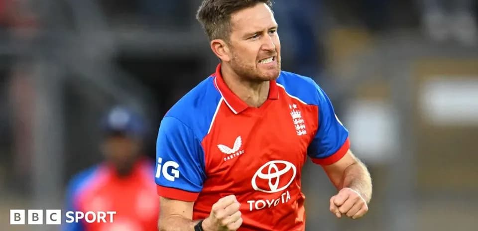 Cricketer celebrating a wicket in red team jersey
