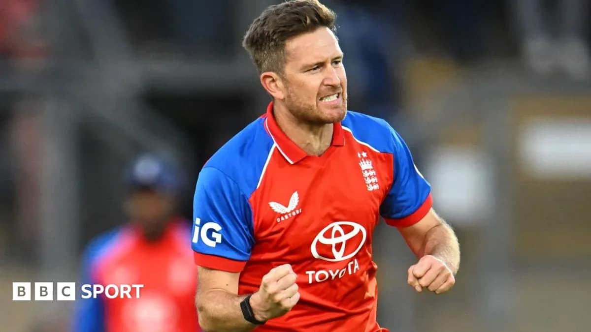 Cricketer celebrating a wicket in red team jersey