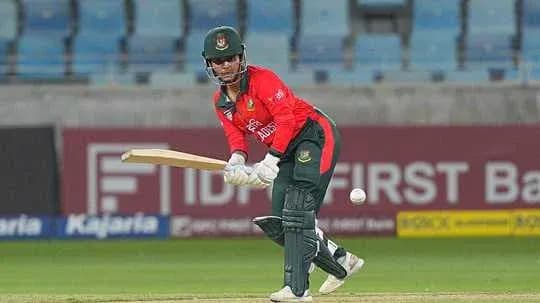 Batsman playing a shot during cricket match