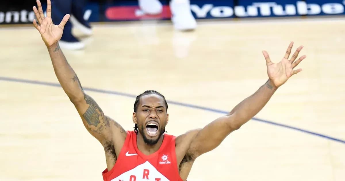 Player celebrating with arms raised during game
