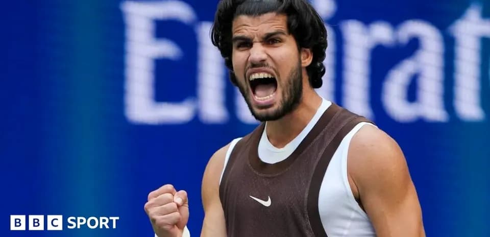 Tennis player celebrating with fist raised during match
