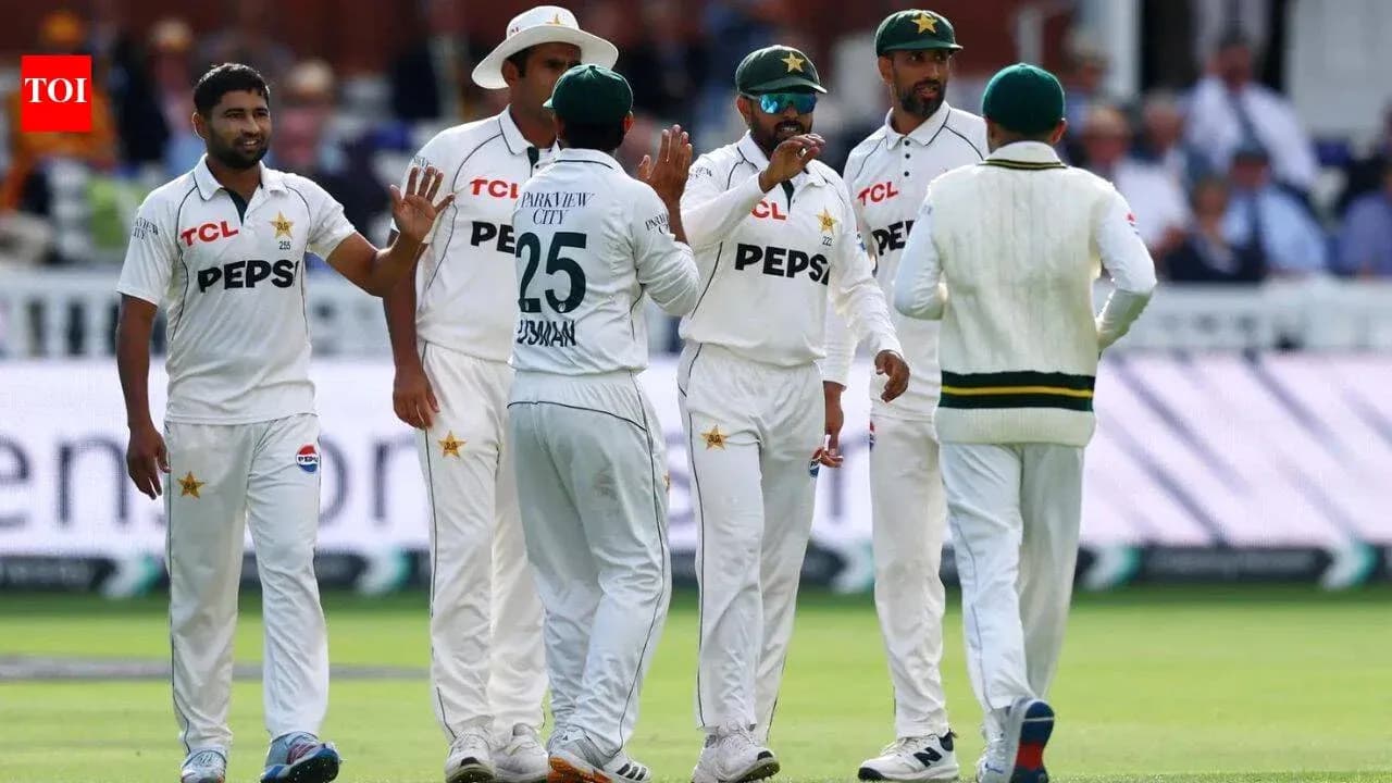 Pakistani cricket players celebrating a wicket on field