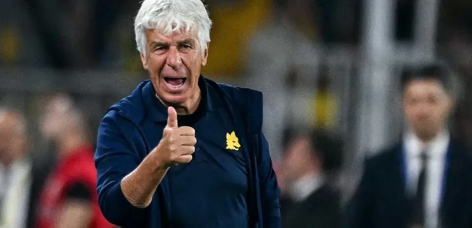 Coach giving thumbs up during match on sidelines