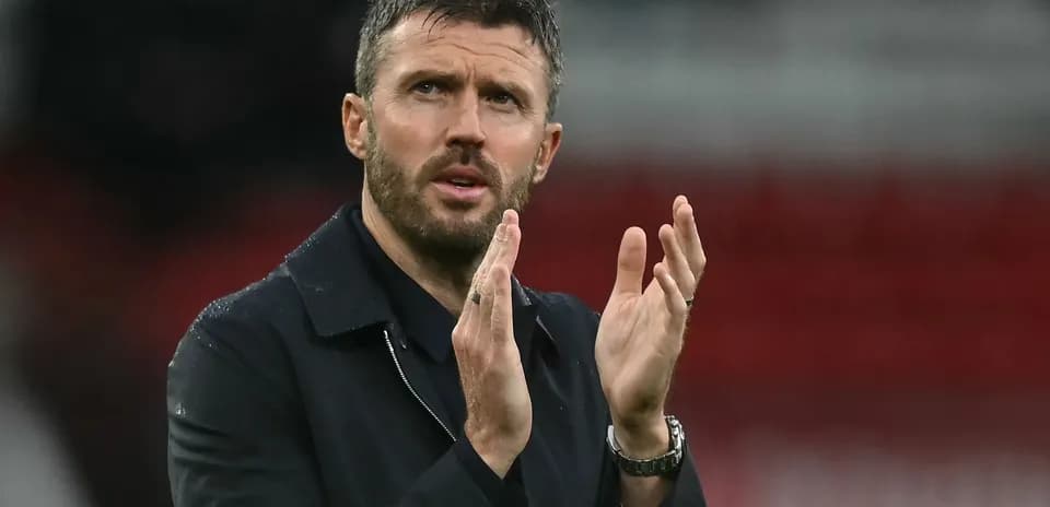 Coach applauding during a football match