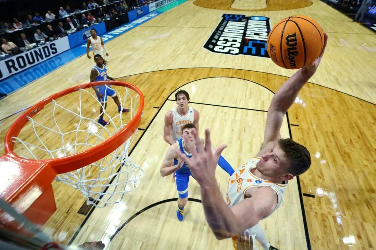 Player dunking during NCAA basketball tournament match