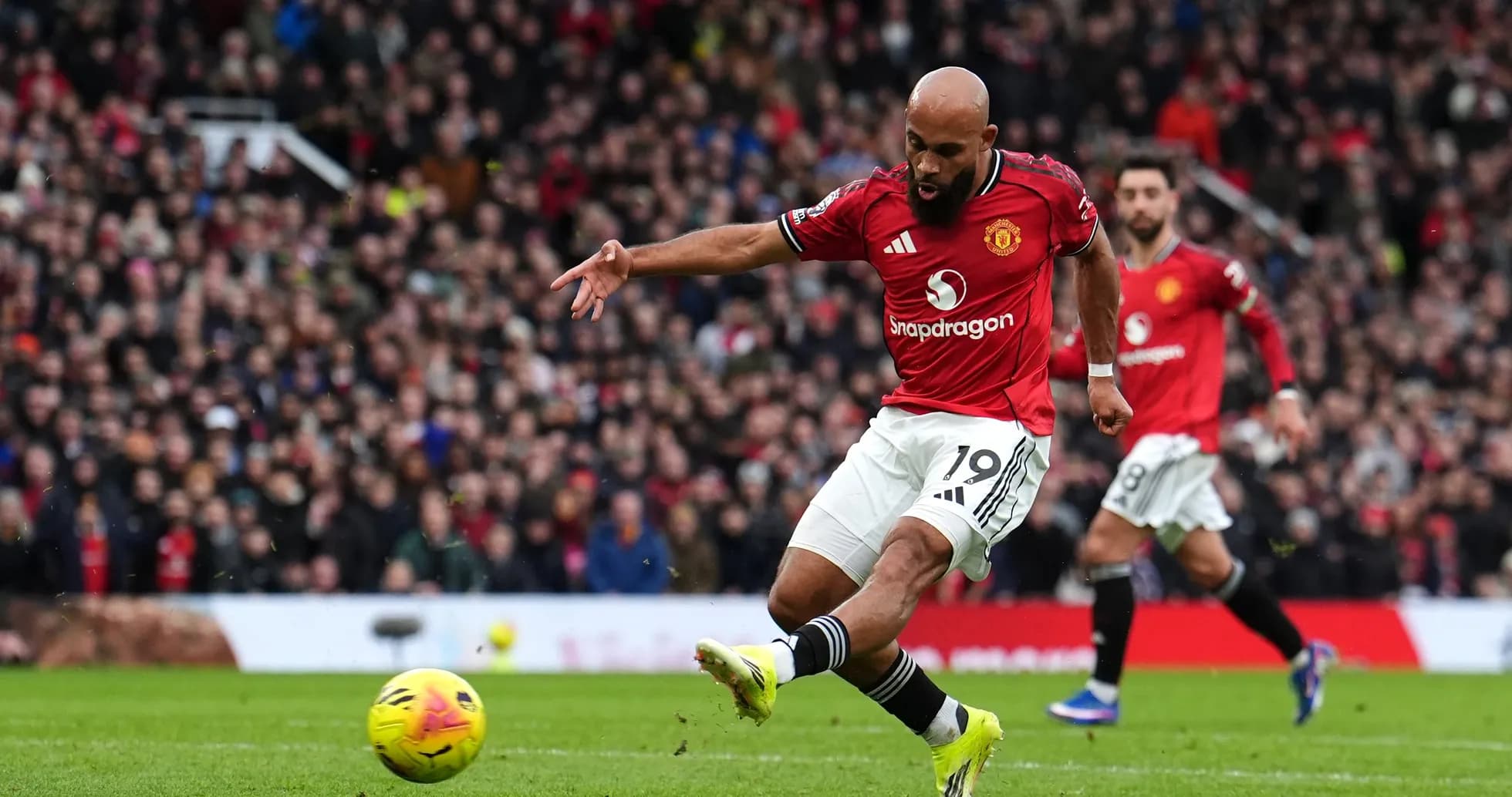 Manchester United player shooting on goal