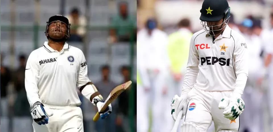 Two cricketers walking off the field in disappointment