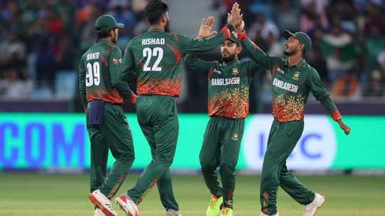 Bangladesh cricket team celebrating a wicket together