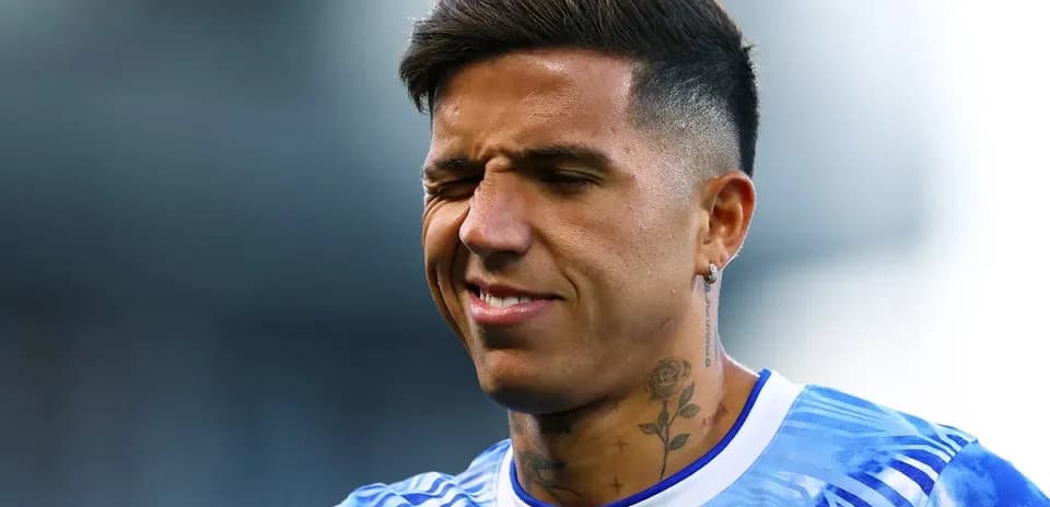 Player with tattoos in blue jersey winking