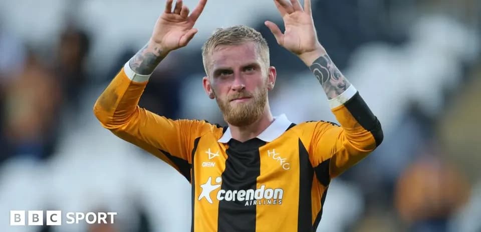 Player celebrating with hands raised after match